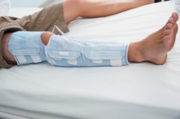 Patient reclining on bed needs a good attorney after a Personal Injury brings him to the hospital.